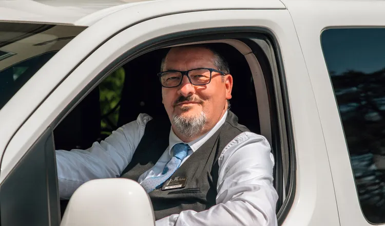 Employee at Arkona Strandhotel parking a car for arriving guests at the hotel